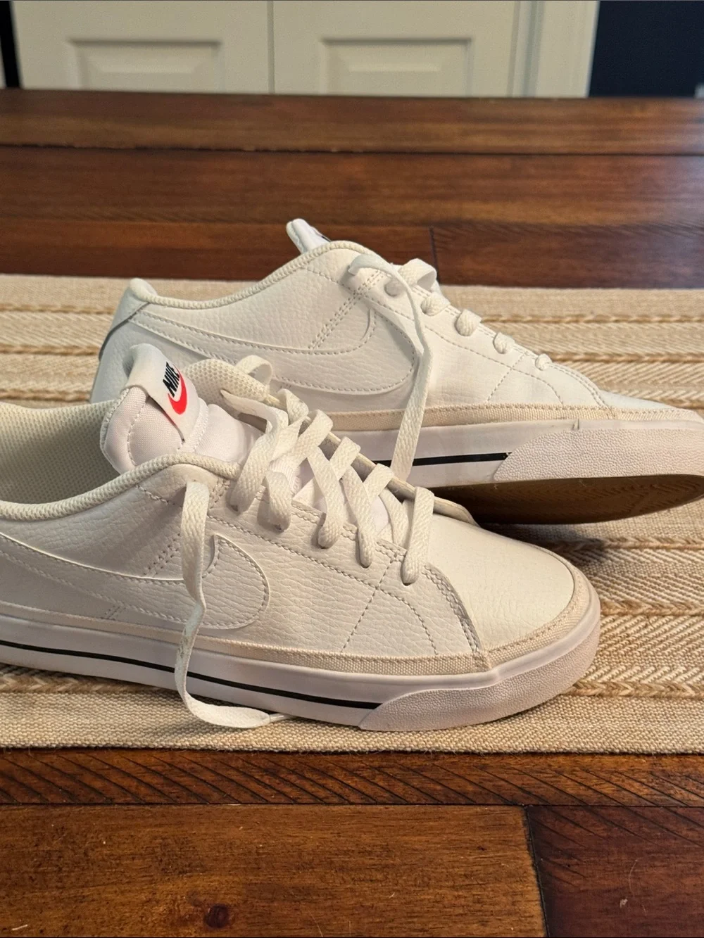 Nike White Low-Top Sneakers with Red Tongue Logo